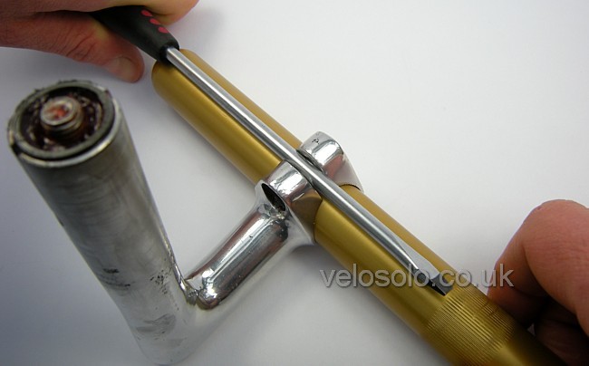 push down with tool to open clamp